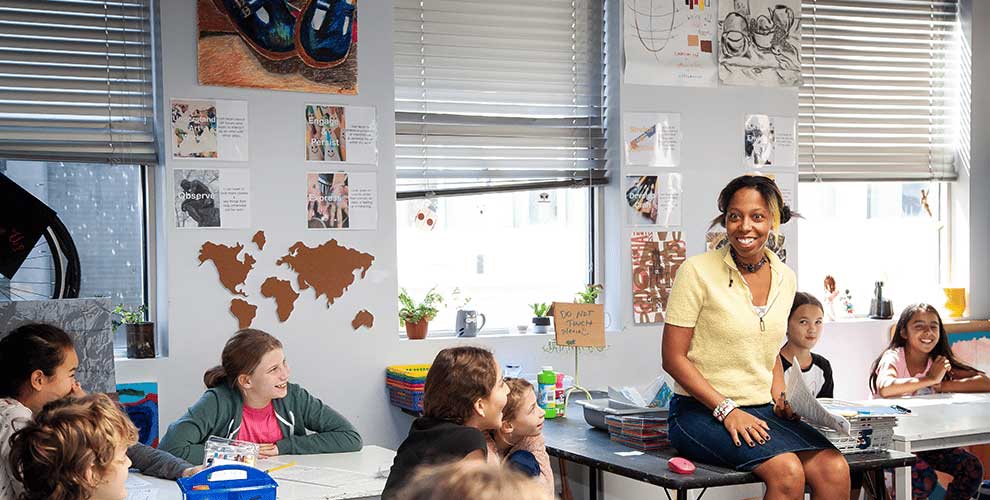 Teacher in classroom with her students