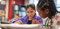 two-girls-writing-in-class_header-apply.png